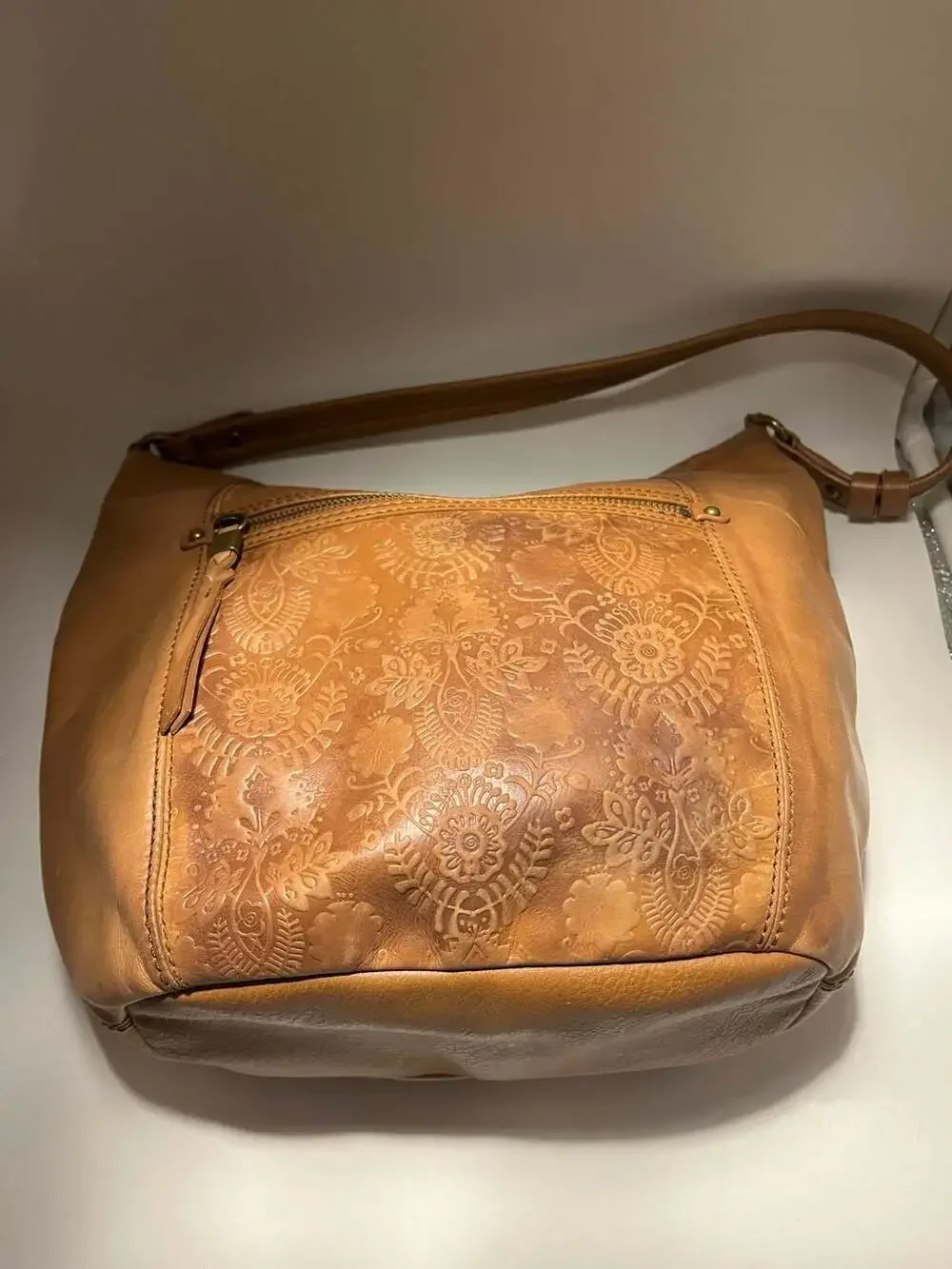 The Sak Sequoia Hobo Bag in Tobacco Floral Embossed Leather